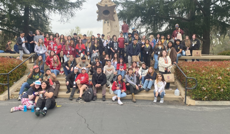 84 students are posing for a group picture at Stanford University